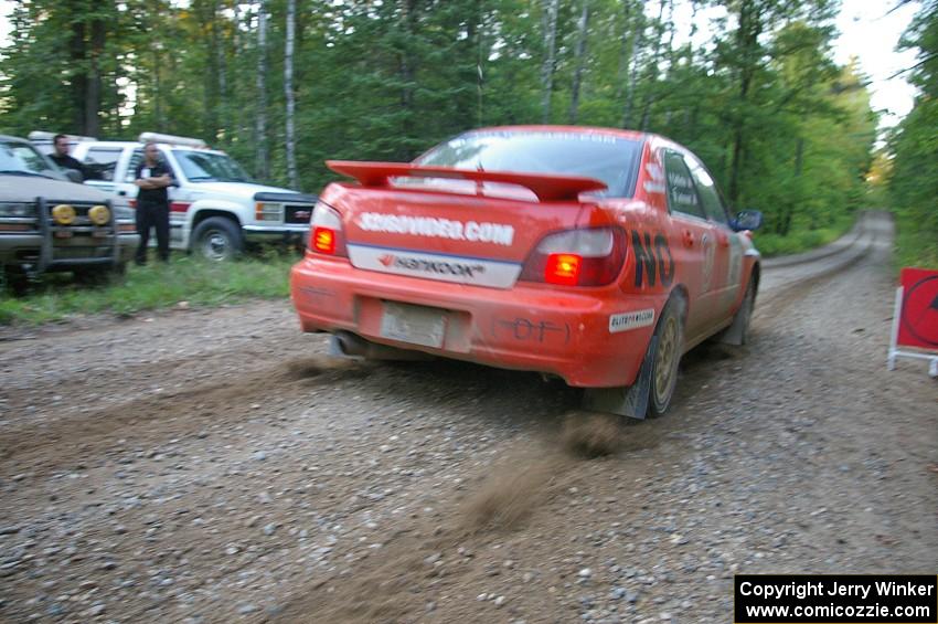 Matthew Johnson / Kim DeMotte release the clutch and let the dirt fly at the start of SS16 in their Subaru WRX.