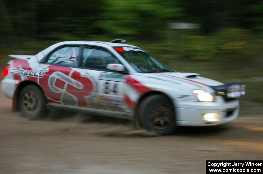 Greg Drozd / John Nordlie prepare for a hard-left on SS16 in their Subaru WRX.