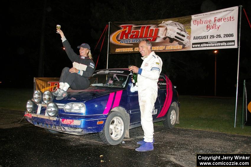 Kathy Jarvis and Martin Headland raise their glasses as they were the sole finishers in the Production class in their VW GTI.