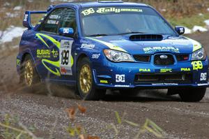 Travis Pastrana / Christian Edstrom rocket uphill at the start of SS1 in their Subaru WRX STi.