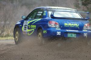 Travis Pastrana / Christian Edstrom drift at a hard left near the start SS1 in their Subaru WRX STi.