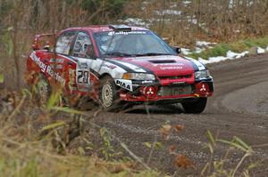 Andrew Comrie-Picard / Marc Goldfarb rocket uphill on SS1 in their aging, but still fast, Mitsubishi Lancer Evo IV.