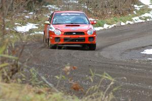 Matthew Johnson / Kim DeMotte at speed in the opening corners of SS1 in their Subaru WRX.