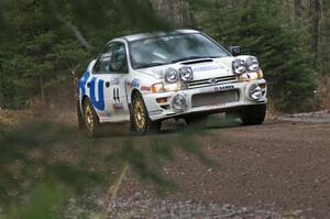 Henry Krolikowski / Cindy Krolikowski drift their Subaru WRX theough the first uphill left on Herman, SS1.