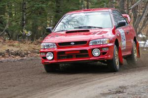 Piotr Wiktorczyk / John Nordlie	at speed through a fast left-hander on SS1, Herman, in their Subaru Impreza.