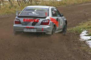 Robert Borowicz / Mariusz Borowicz hang the back end out at the first hard-right on SS1, Herman, in their Subaru WRX STi.