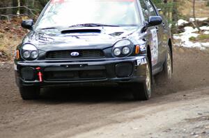 Pat Moro / Mike Rossey drift their Subaru WRX at the first hard left on SS1, Herman.