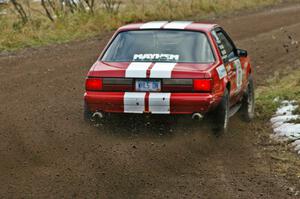 Mark Utecht / Rob Bohn throw rooster-tails off the rear tires on their Ford Mustang on SS1, Herman.