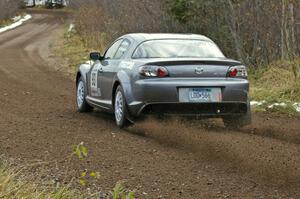 Bob Olson / Ryan Johnson at speed on SS1, Herman, in their Mazda RX-8.