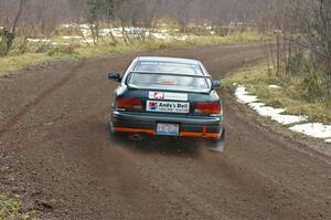 Mark Podoluch / Mariusz Malik at speed through a fast right-hander on SS1, Herman, in their Subaru Impreza.