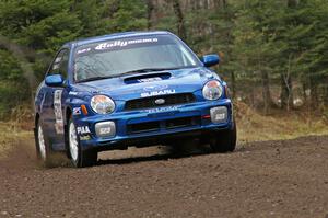 Travis Hanson / Terry Hanson drift through a left-hander near the start of SS1, Herman, in their Subaru WRX.