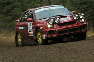 Bryan Pepp / Jerry Stang head uphill on Herman, SS1, in their Subaru WRX.