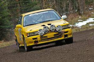 Erik Payeur / Adam Payeur head through a fast sweeping left near the start of SS1, Herman, in their Mitsubishi Galant.