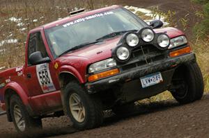 Jim Cox / Scott Parrott drift their Chevy S-10 through a fast left-hand sweeper near the start of SS1, Herman.