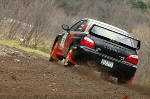 Josh Chang / Jeff Cruzan drift wide through the first fast left-hander on Herman, SS1, in their Subaru WRX STi.