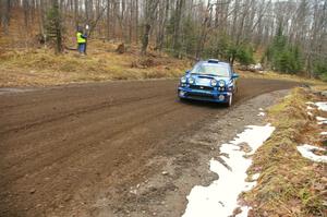 Heath Nunnemacher / Chris Coughlin head uphill through one of the first corners of Herman, SS1, in their Subaru WRX.