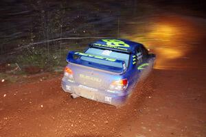 Travis Pastrana / Christian Edstrom sling gravel at the final corner of SS3, Echo Lake 1, in their Subaru WRX STi.