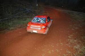 Matthew Johnson / Kim DeMotte hang the tail out on their Subaru WRX at the final corner of SS3, Echo Lake 1.