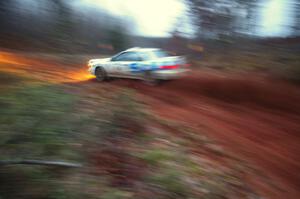 Henry Krolikowski / Cindy Krolikowski drift hard at the final corner of SS3, Echo Lake 1, in their Subaru WRX.