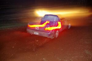 Travis Hanson / Terry Hanson sling gravel and head uphill at the final corner of SS3, Echo Lake 1, in their Subaru WRX.