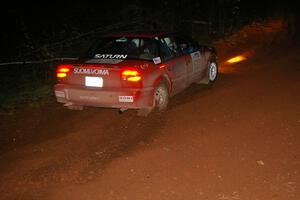 Craig Walli / Jonah Liubakka hang the tail out through a left-hander near the end of Echo Lake 1, SS3, in their Saturn SL-2.