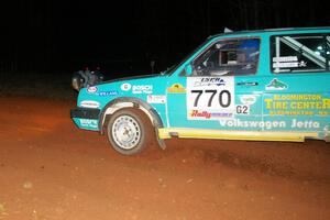 Miles Bothee / Ben Slocum VW Jetta at speed at the final corner of Echo lake 1, SS3.