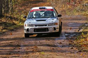 Chris Gilligan / Joe Petersen Mitsubishi Lancer Evo IV heads uphill into the final corner of SS8, Gratiot Lake 1.