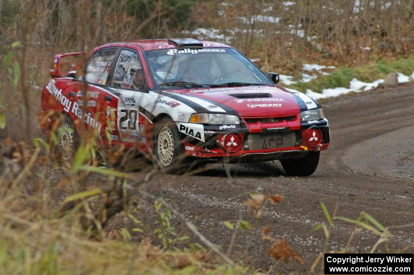 Andrew Comrie-Picard / Marc Goldfarb rocket uphill on SS1 in their aging, but still fast, Mitsubishi Lancer Evo IV.