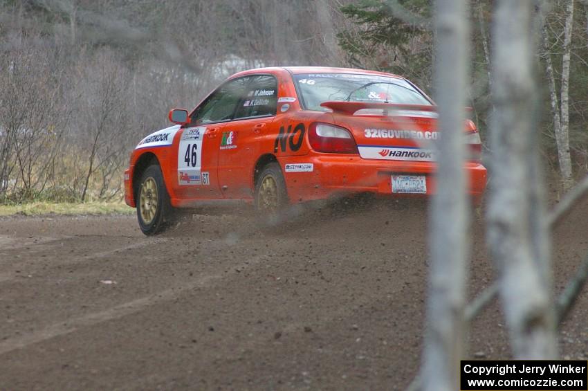 Matthew Johnson / Kim DeMotte hang the tail out on their Subaru WRX at the first tight left hander on SS1.