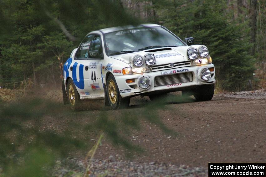 Henry Krolikowski / Cindy Krolikowski drift their Subaru WRX theough the first uphill left on Herman, SS1.