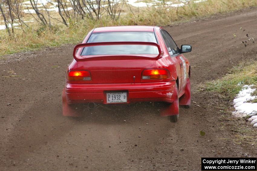 Piotr Wiktorczyk / John Nordlie	sling gravel at a right-hander on SS1, Herman, in their Subaru Impreza.