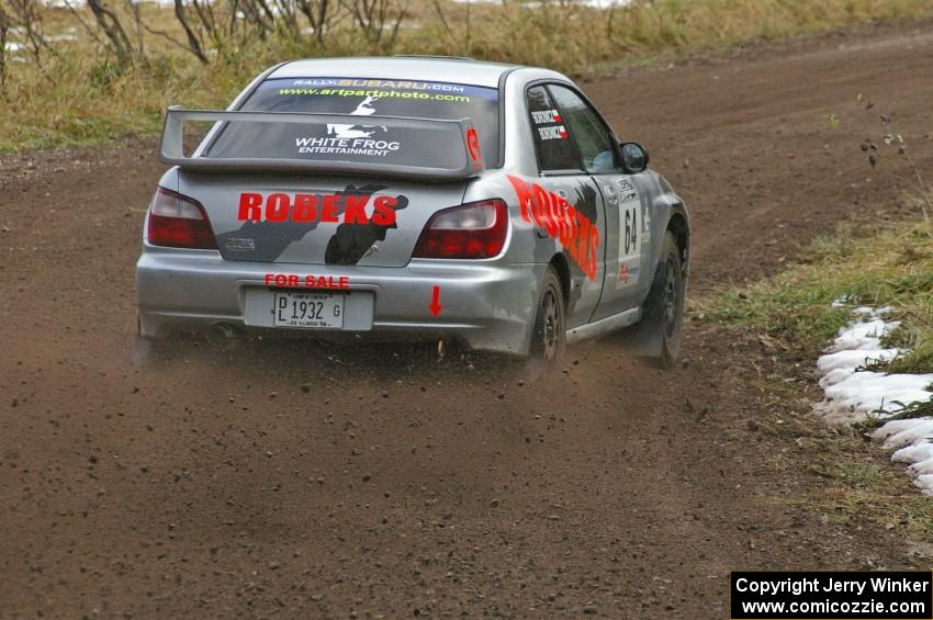 Robert Borowicz / Mariusz Borowicz hang the back end out at the first hard-right on SS1, Herman, in their Subaru WRX STi.