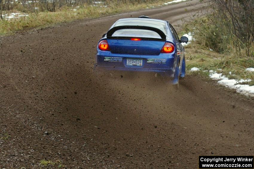 Cary Kendall / Scott Friberg sling gravel at a fast sweeping right on SS1 in their Dodge SRT-4.