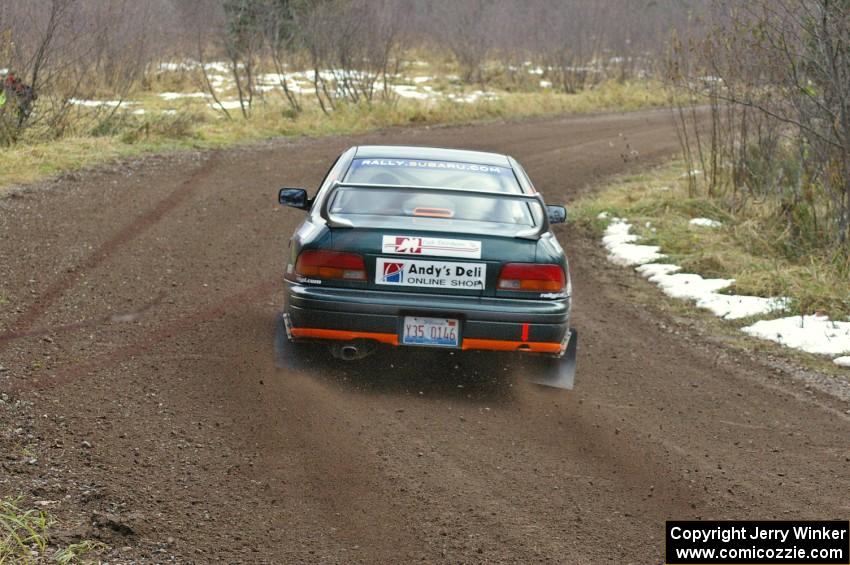 Mark Podoluch / Mariusz Malik at speed through a fast right-hander on SS1, Herman, in their Subaru Impreza.