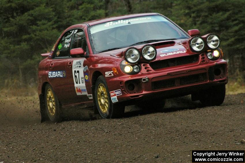 Bryan Pepp / Jerry Stang head uphill on Herman, SS1, in their Subaru WRX.