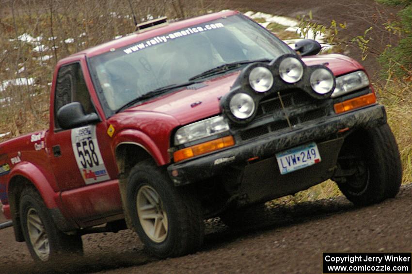 Jim Cox / Scott Parrott drift their Chevy S-10 through a fast left-hand sweeper near the start of SS1, Herman.