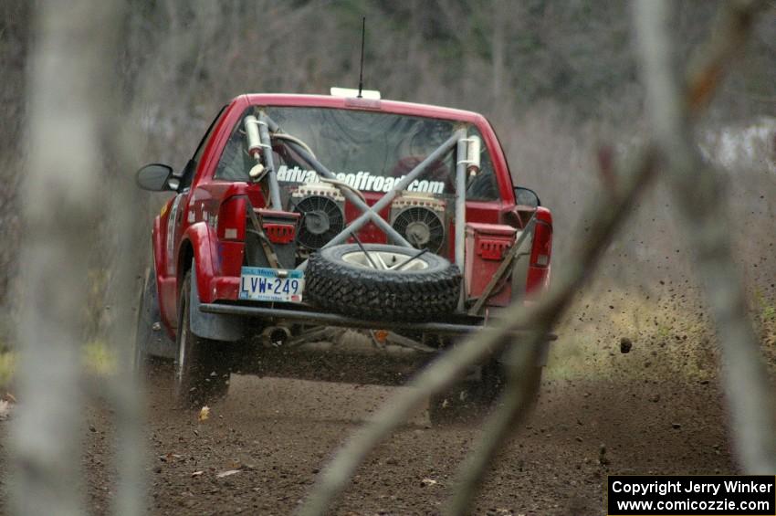 Jim Cox / Scott Parrott sling rocks in their Chevy S-10 through a fast left-hand sweeper near the start of SS1, Herman.