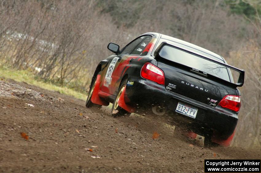 Josh Chang / Jeff Cruzan drift wide through the first fast left-hander on Herman, SS1, in their Subaru WRX STi.