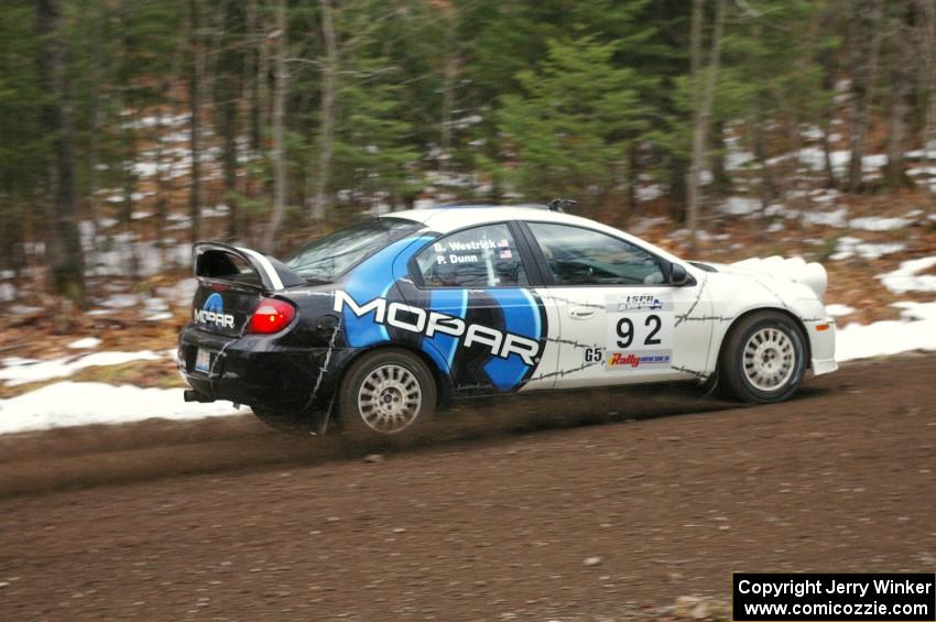 Paul Dunn / Bill Westrick head uphill at speed on Herman, SS1, in their Dodge SRT-4.