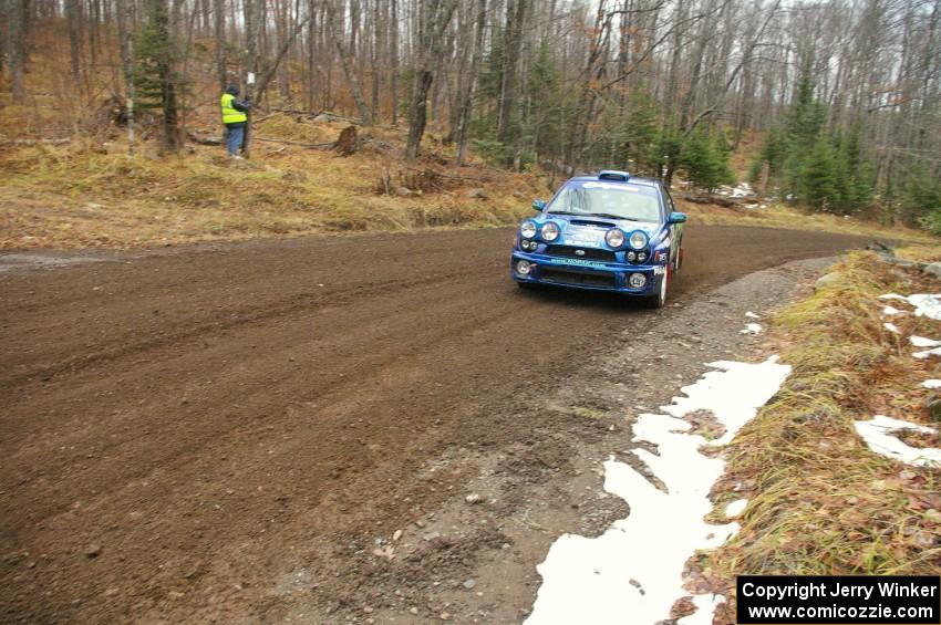 Heath Nunnemacher / Chris Coughlin head uphill through one of the first corners of Herman, SS1, in their Subaru WRX.