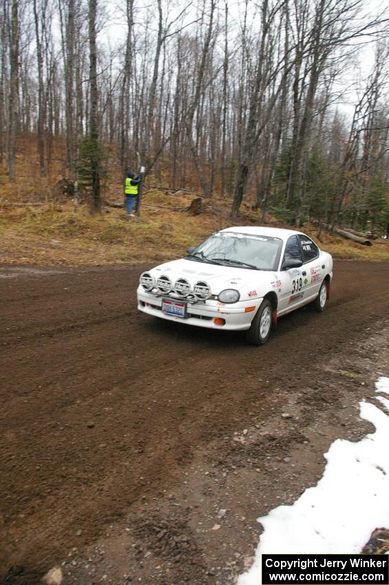 Chris Greenhouse / Matt Smith in their Plymouth Neon head uphill near the start of SS1, Herman.