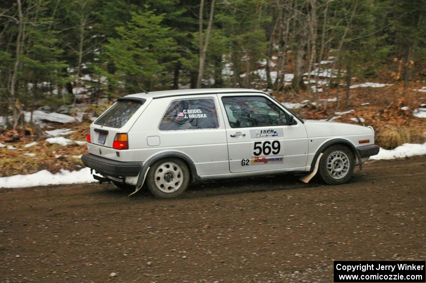 John Hruska / Carl Seidel head uphill through the first corners of Herman, SS1, in their VW GTI.