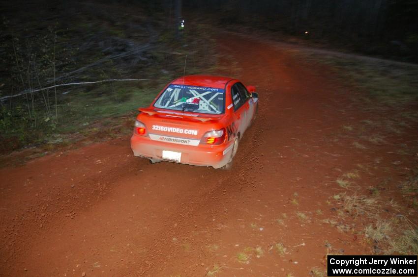 Matthew Johnson / Kim DeMotte hang the tail out on their Subaru WRX at the final corner of SS3, Echo Lake 1.