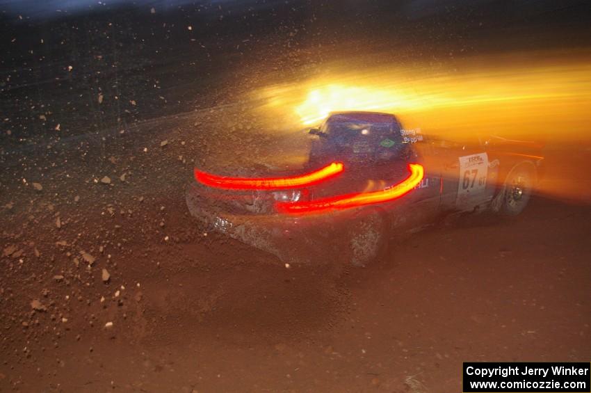 Bryan Pepp / Jerry Stang sling gravel and head uphill after the final corner of SS3, Echo lake 1, in their Subaru WRX.