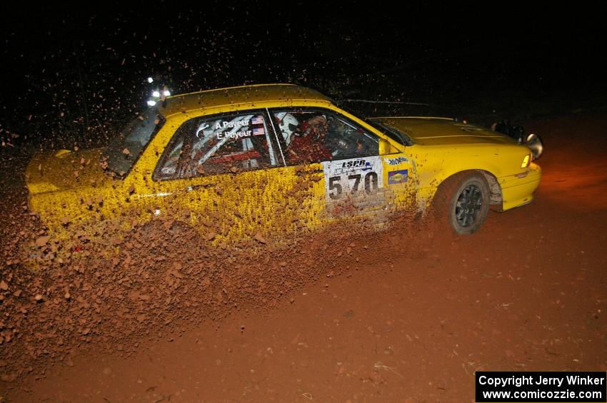 Erik Payeur / Adam Payeur sling loads of gravel upward at the final uphill left on Echo Lake 1, SS3, in their Mitsubishi Galant.