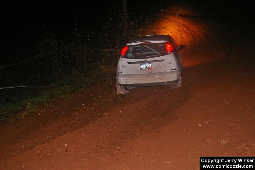 Mike Gagnon / Bob Martin go through an uphill left near the finish of SS3, Echo Lake 1, in their Ford Focus ZX3.