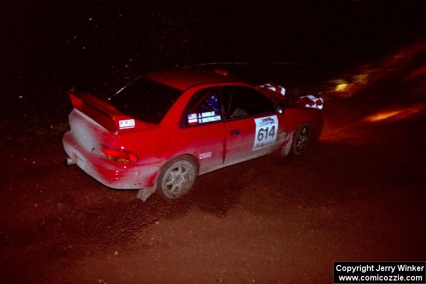 The Piotr Wiktorczyk / John Nordlie Subaru Impreza goes through an uphill left near the finish of Echo Lake 2.