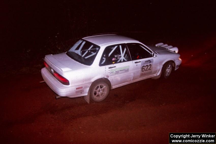 The Larry Parker / Mandi Gentry Mitsubishi Galant VR-4 goes through an uphill left near the finish of Echo Lake 2.