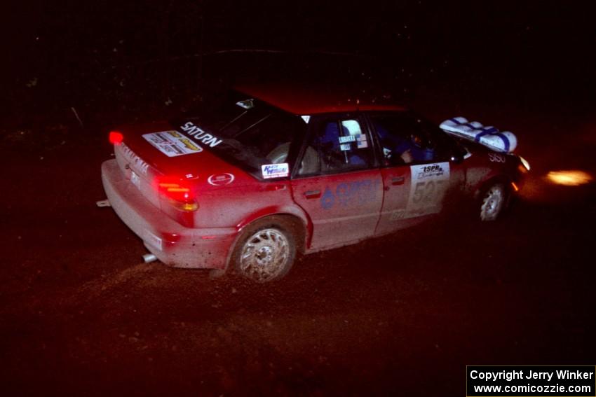 The Craig Walli / Jonah Liubakka Saturn SL-2 goes through an uphill left near the finish of Echo Lake 2.