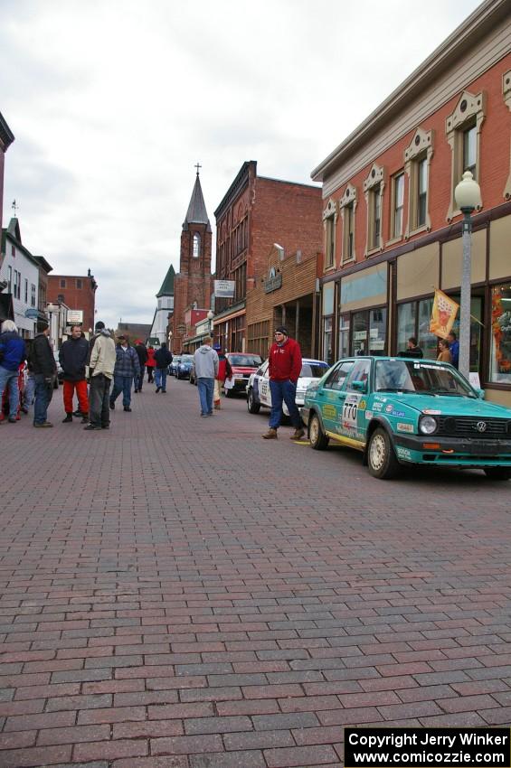 Miles Bothee / Ben Slocum VW Jetta and others on the main street of Calumet during day two parc expose.